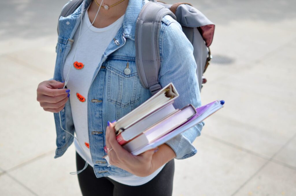 person with text books