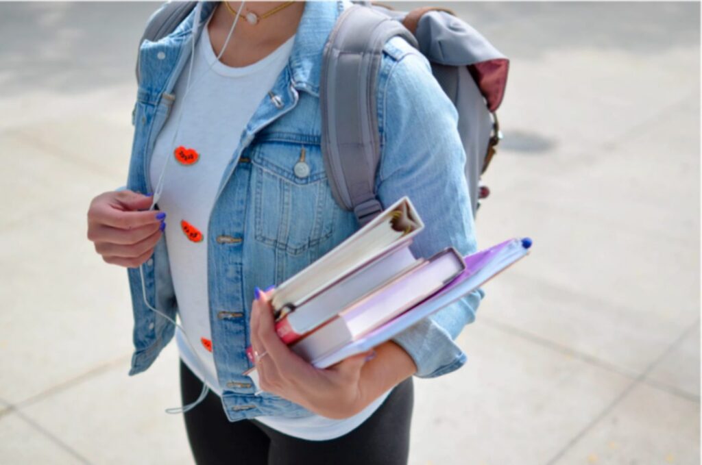 person with text books