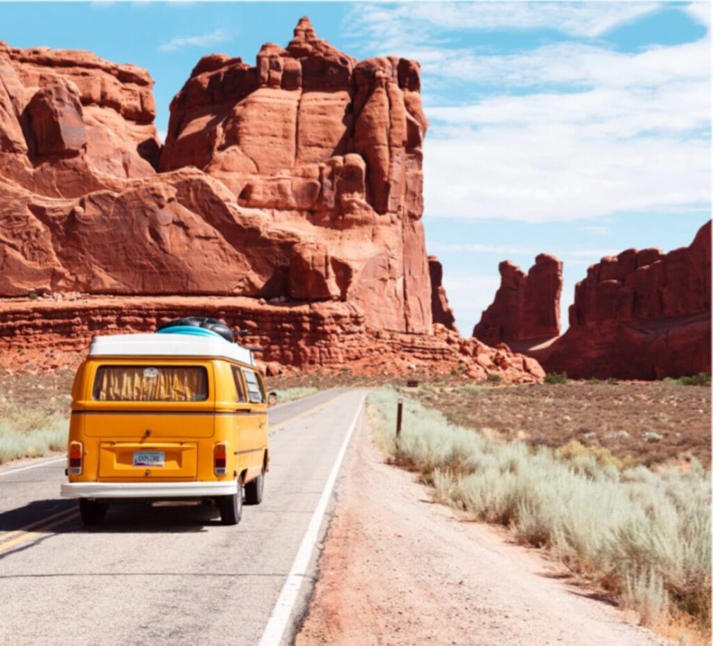 VW van driving in the desert